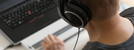 Web developer working with headphones